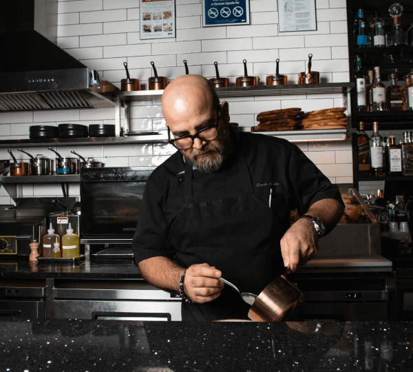 Chef Cosme preparing a dish