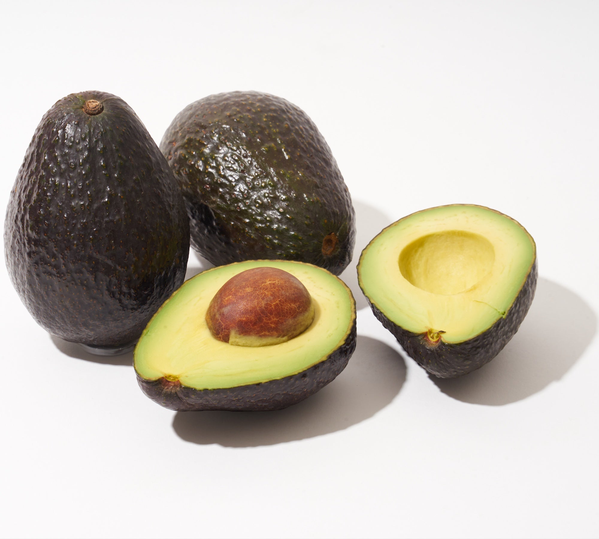 3 Avocados - 1 open in half - Davocadoguy Avocados are the perfect fix for Potassium daily intake. Keep muscle cramps away. Discover all of the benefits of adding avocados to your daily diet!