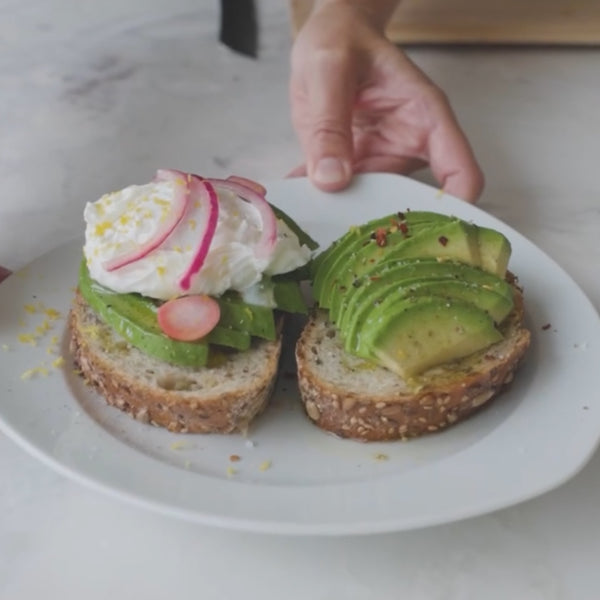 Avocado Toast with poached egg, pickled radishes and onions, red pepper flakes, olive oil, lemon zest and honey. We present to you DavocadoToast