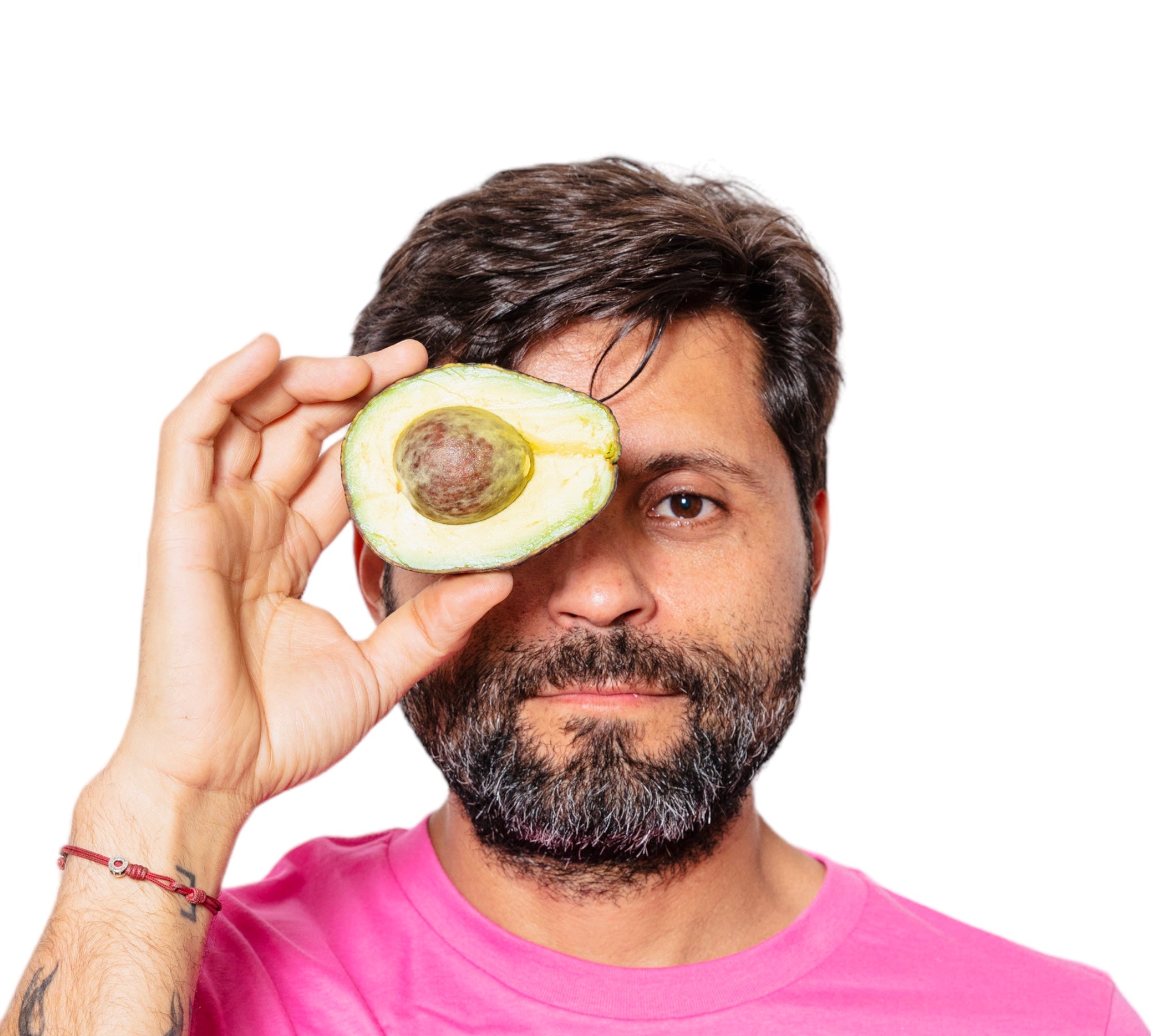 Avocados can help protect your eyesight thanks to Lutein and Vitamin E. Davocadoguy holding a half avocado in front of his right eye. 