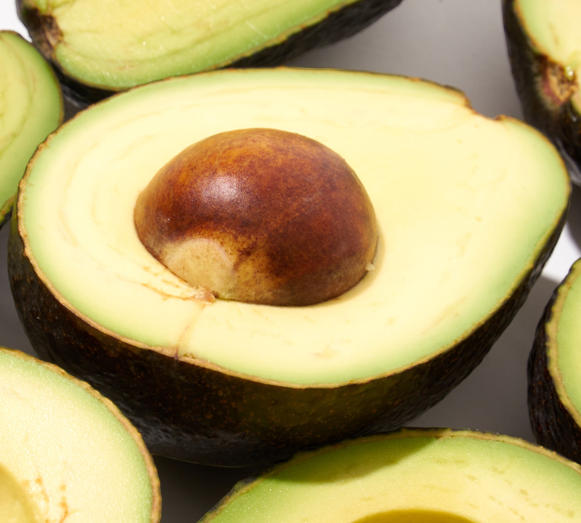 Avocados cut open in halves. They are a Fiber superfood and contains both soluble and insoluble dietary Fibers.