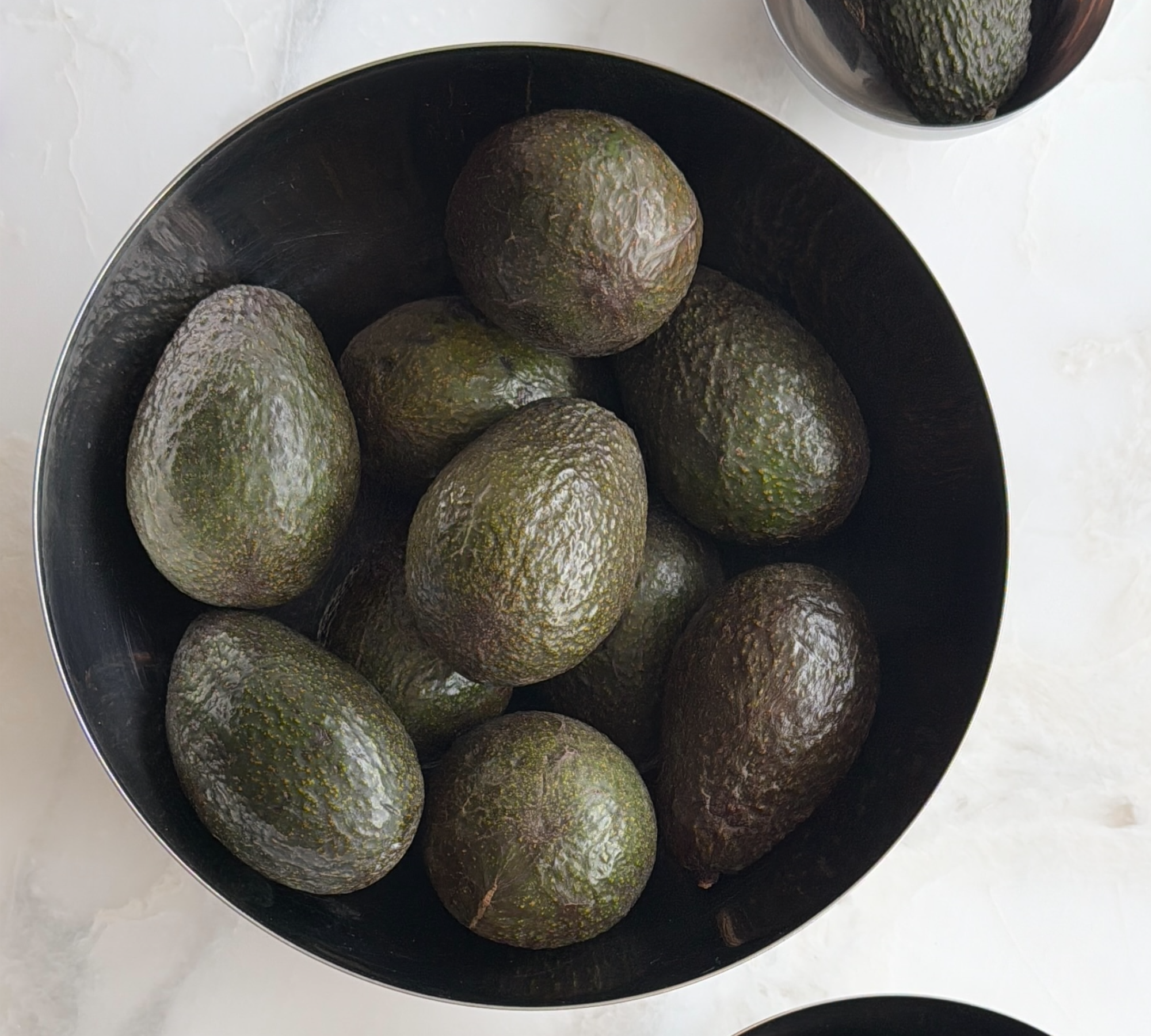 Bowl of avocados on a countertop