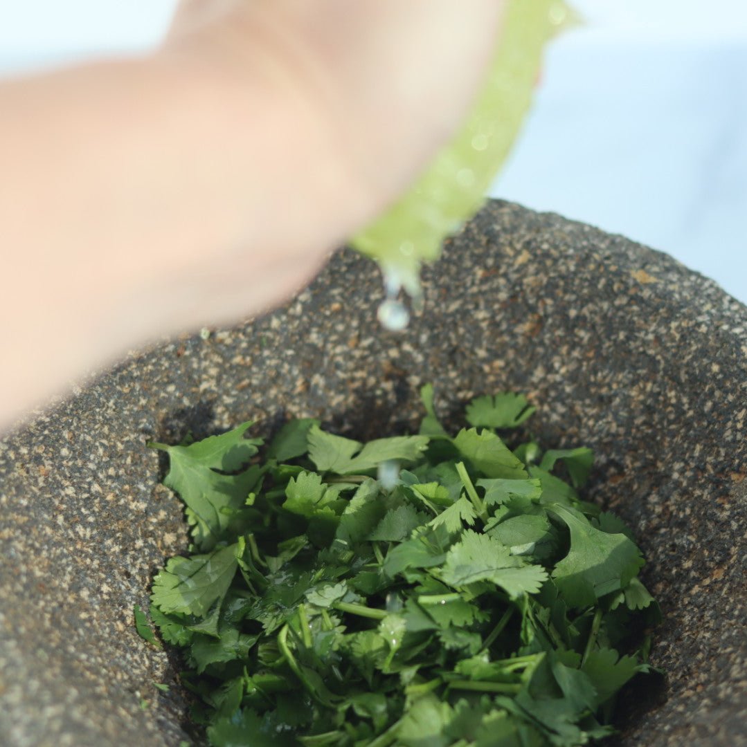 Grind the cilantro, pepper with the lime juice