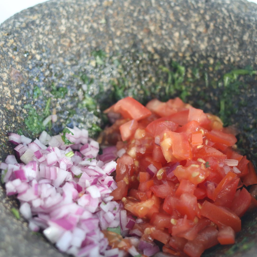 mix the finely chopped cilantro, onion and tomato in a bowl with the lime juice