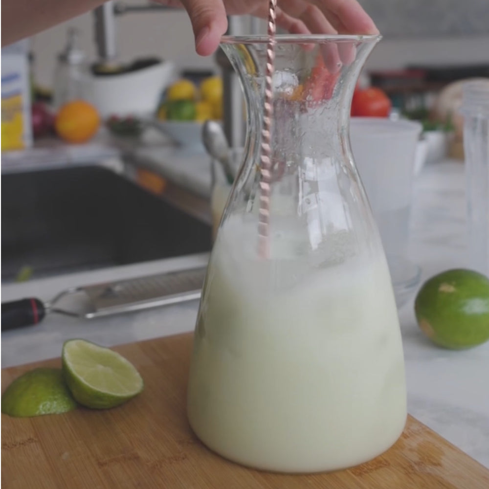 Pour limeade into an ice filled pitcher