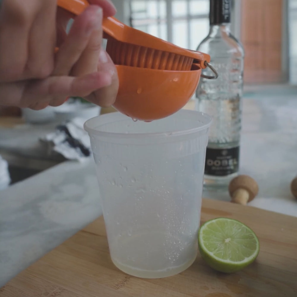 Juice Limes into a pouring container