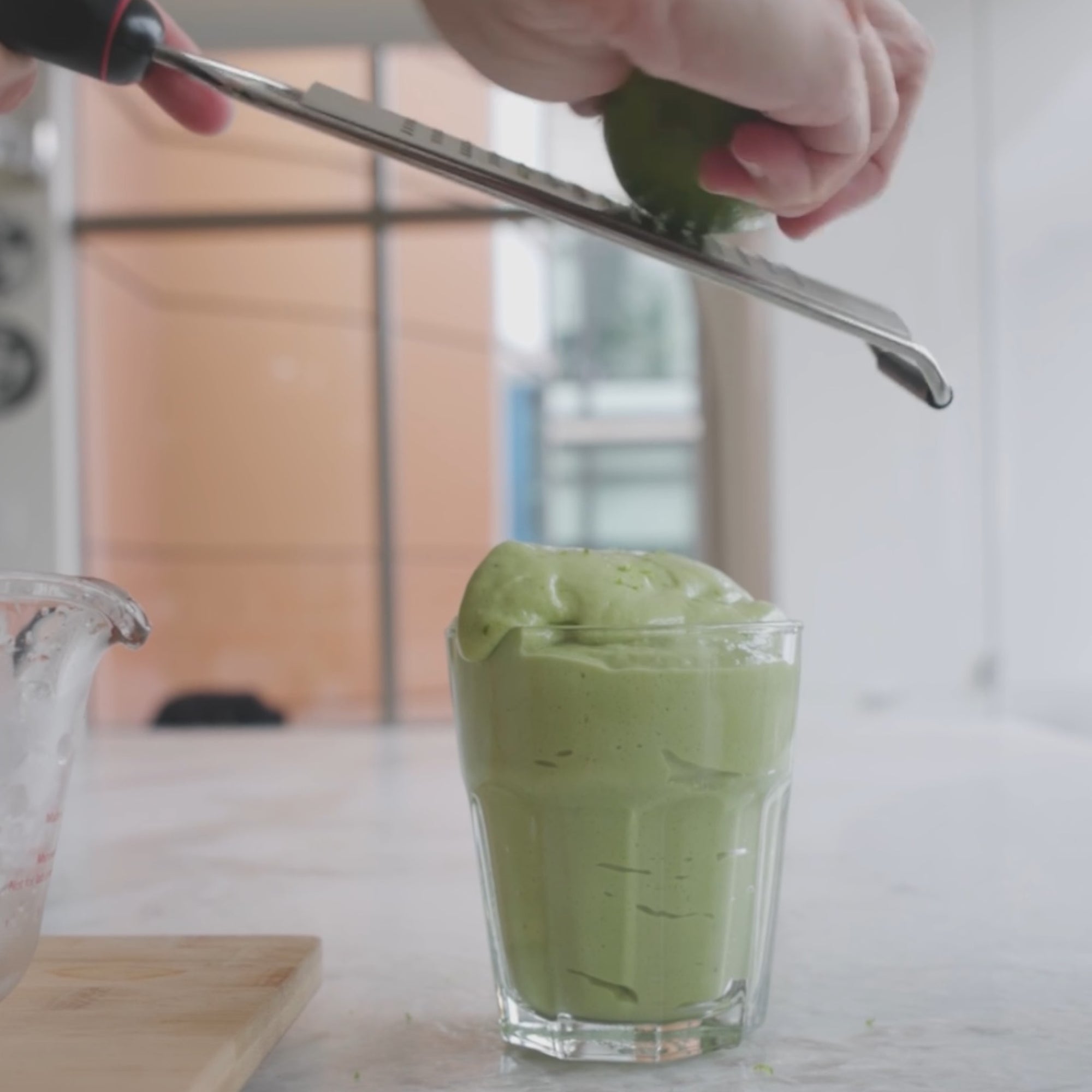 Zest a previously rinsed lime