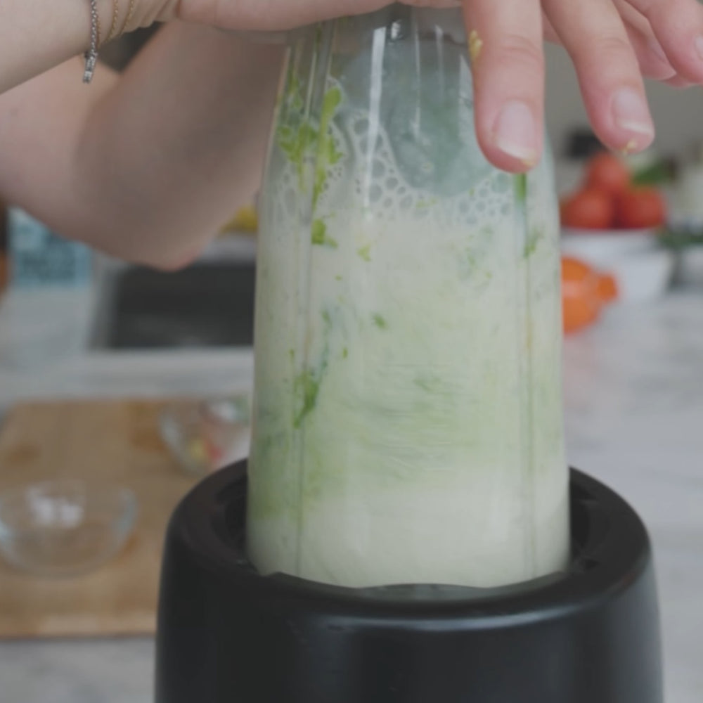 Blend the fruit with milk and ice until smooth.
