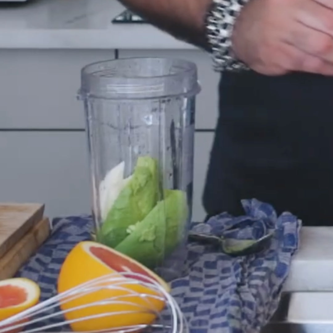 ingredients, including avocado, placed in a blender for mixing