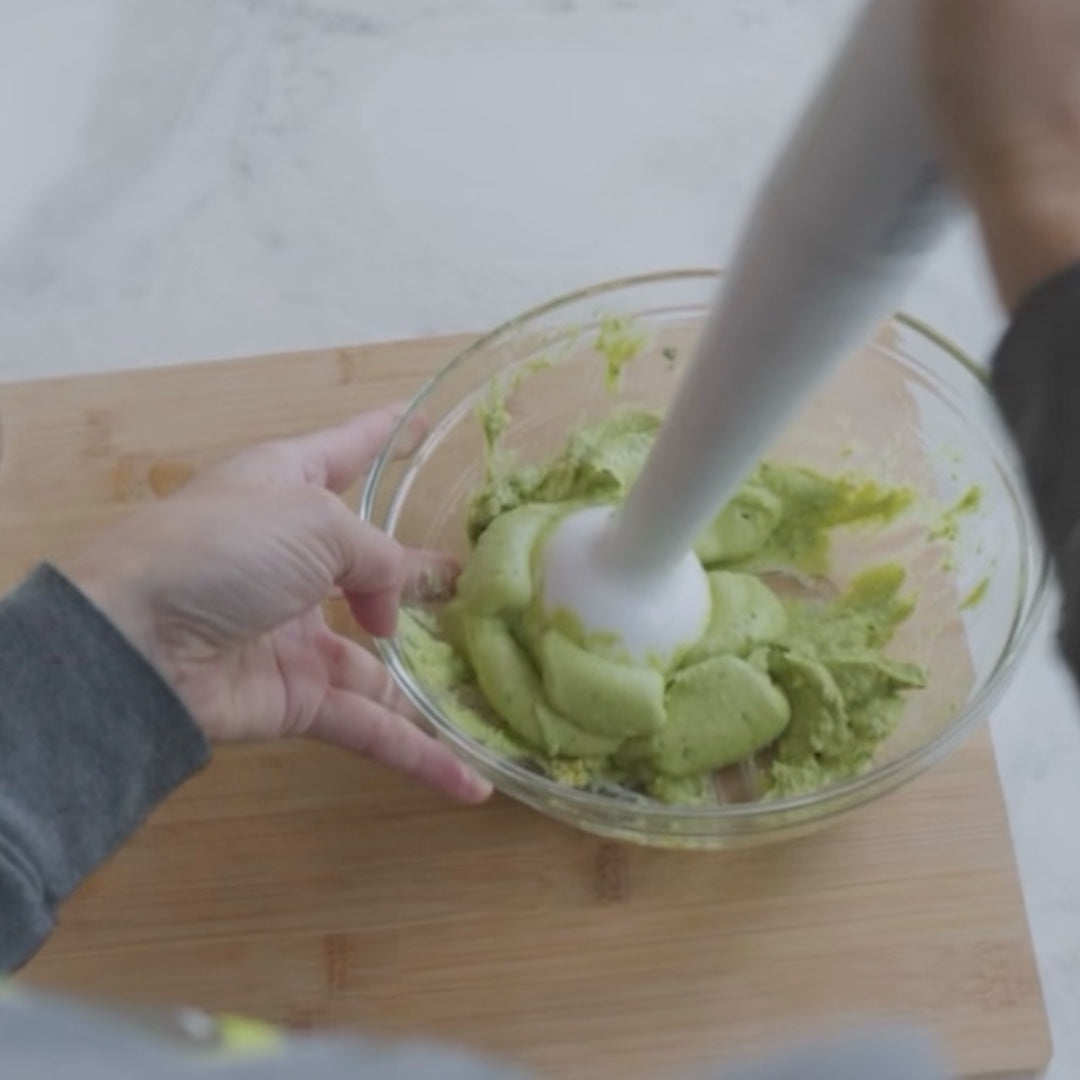 mashing avocados in a bowl
