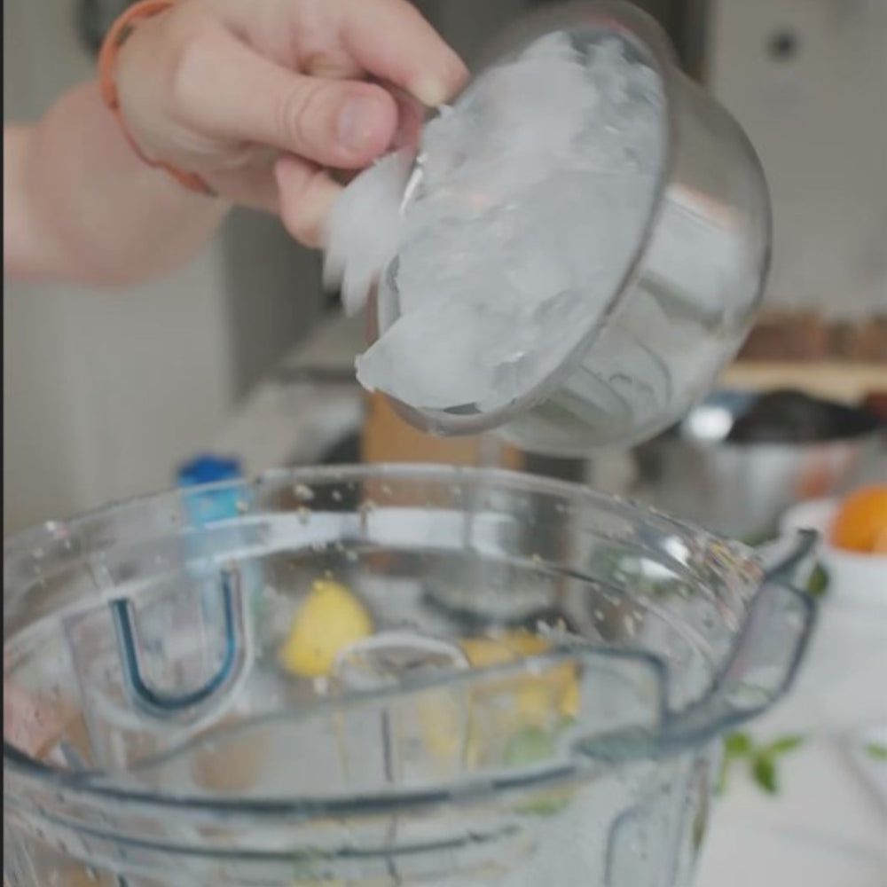 pourring ice cubes in a blender